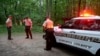 Authorities secure the entrance to Mine Bank Trail, an access point to the rescue operation along the Blue Ridge Parkway where a Cessna Citation crashed over mountainous terrain near Montebello, Va., June 4, 2023. (Randall K. Wolf via AP)