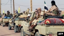 Les colonels qui ont pris le pouvoir par la force en 2020 ont remporté un succès symbolique largement salué au Mali, mais les rebelles n’ont pas déposé les armes et se sont dispersés dans cette région désertique et montagneuse. (Photo by STRINGER / AFP)