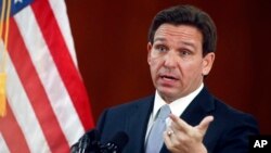 FILE - Florida Gov. Ron DeSantis answers questions March 7, 2023, at the state Capitol in Tallahassee, Fla.