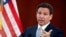 FILE - Florida Governor Ron DeSantis answers questions in Tallahassee, Florida, March 7, 2023. DeSantis has signed a law that places severe restrictions on the ability of some non-U.S. citizens to purchase property in Florida.