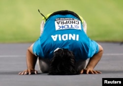 India's Neeraj Chopra celebrates winning gold in the men's javelin throw at the World Athletics Championship, Budapest, Hungary, Aug. 27, 2023.