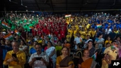 Schoolchildren celebrate the successful landing of spacecraft Chandrayaan-3 on the moon, in a school in Guwahati, India, Aug. 23, 2023.