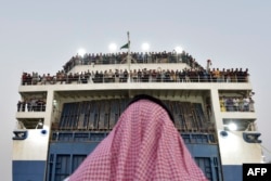 A boat with 1,687 civilians from more than 50 countries fleeing violence in Sudan, arrives at King Faisal navy base in Jeddah, Saudi Arabia, April 26, 2023