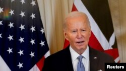 U.S. President Joe Biden speaks during a joint press conference with Kenyan President William Ruto at the White House in Washington, May 23, 2024. A political consultant has been indicted over fake robocalls imitating Biden's voice.