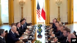 President Joe Biden meets with Polish President Andrzej Duda and Polish Prime Minister Donald Tusk in the East Room of the White House, in Washington, March 12, 2024.