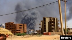 FILE - Smoke rises above buildings after an aerial bombardment during clashes between Sudan's Army and the paramilitary Rapid Support Forces, in Khartoum, Sudan, May 1, 2023. 