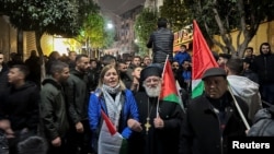 Palestinians take part in a protest against the killing of senior Hamas official, Saleh al-Arouri, in Ramallah in the Israeli-occupied West Bank Jan. 2, 2024.