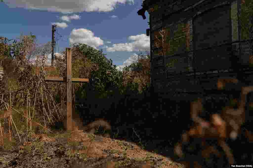 Due to intense shelling, residents of Velyka Novosilka, Ukraine, bury loved ones in makeshift graves in their yards, shown on Aug. 23, 2023.