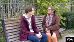 The parents of Agnes Scelle, right, lived through the Normandy landings. Today she is focused on another war as she helps Ukrainian refugees like Kateryna Vorontsova, left, settle in in Carentan and surrounding villages. (Lisa Bryant/VOA)