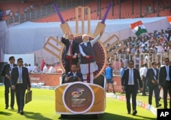 Indian Prime Minister Narendra Modi with his Australian counterpart Anthony Albanese wave as they arrive in the stadium to watch fourth cricket test match between India and Australia in Ahmedabad, India, March 9, 2023.