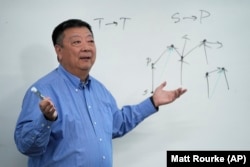 Dr. Pei Wang teaches an artificial general intelligence class at Temple University in Philadelphia, Thursday, Feb. 1, 2024. (AP Photo/Matt Rourke)