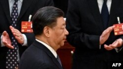 Le président chinois Xi Jinping à son arrivée pour la cinquième session plénière de l'Assemblée populaire nationale (APN) au Grand Palais du Peuple à Pékin le 12 mars 2023. 