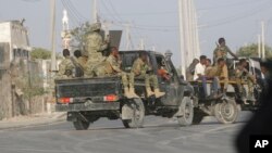FILE - A security force patrols the streets during fighting between al-Shabab extremists and soldiers in Mogadishu, Somalia, Feb. 21, 2023.