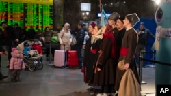 Activists sing carols at a railway station in Kyiv, Ukraine, Dec. 21, 2023. For the first time since 1917, Ukraine will celebrate Christmas on December 25 instead of January 7, the date that Russia celebrates. The move reflects another Ukrainian cultural shift away from Russia. 