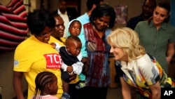 FILE - U.S. first lady Jill Biden, right, reacts during a visit to a U.S. President's Emergency Plan for AIDS Relief (PEPFAR) project at an informal settlement near Windhoek, Namibia, Feb. 23, 2023.