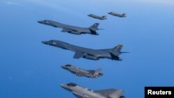 FILE - U.S. Air Force B-1B bombers, F-16 fighter jets and South Korean Air Force F-35A take part in a joint air drill, South Korea, March 19, 2023. U.S. and South Korean forces have been holding air and navy drills this year. (South Korean Defense Ministry/Handout via Reuters) 