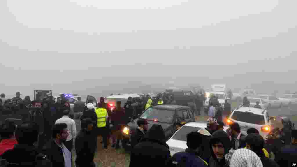 In this photo provided by Moj News Agency, rescue teams and people are seen near the site of the incident of the helicopter carrying Iranian President Ebrahim Raisi in Varzaghan in northwestern Iran, May 19, 2024.