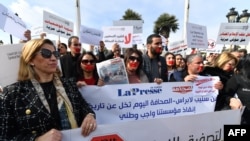 Tunisian journalists protest in front of the Prime Minister's office in Tunis, Feb. 16, 2023, in defense of freedom of expression and against the persecution of journalists.