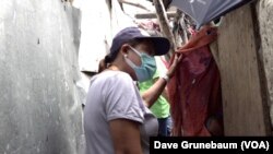 In Taguig, Philippines, May 18, 2023, health workers including Ma. Nieves Bulalacao hit the streets going door to door to educate parents on the importance of routine vaccines for children.