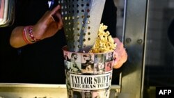 A tub of popcorn in US singer Taylor Swift's merchandise is pictured during the 'Taylor Swift: The Eras Tour' concert movie world premiere at AMC Century City theatre in Century City, California, Oct. 12, 2023. 