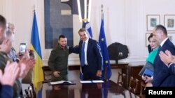 Greek Prime Minister Kyriakos Mitsotakis and Ukrainian President Volodymyr Zelenskyy meet at the Maximos Mansion in Athens, Greece, Aug. 21, 2023.