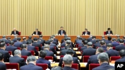 In this photo released Dec. 12, 2023, by Xinhua News Agency, Chinese President Xi Jinping leads delivers a speech at the annual Central Economic Work Conference in Beijing.