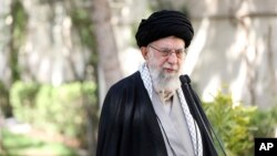 In this picture released by the official website of the office of the Iranian supreme leader, Supreme Leader Ayatollah Ali Khamenei speaks after planting a tree near his office, March 6, 2023. He said the recent poisoning of Iranian schoolgirls was an "unforgivable" crime. 