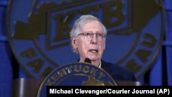 FILE - U.S. Senator Mitch McConnell speaks at the Kentucky Farm Bureau's annual Country Ham Breakfast at the Kentucky State Fair in Louisville, Kentucky, Aug. 24, 2023. (Michael Clevenger/Courier Journal via AP)