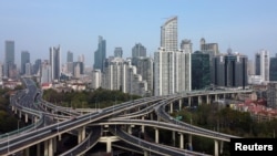 FILE - An aerial view shows highways and buildings in Shanghai, China, March 30, 2022. Picture taken with a drone.