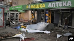 A view of blood on the ground at the scene after deadly Russian shelling that hit a bus station in Kherson, Ukraine, Feb. 21, 2023.