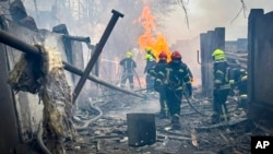 Emergency services crews work at the scene of a Russian attack in Odesa, Ukraine, March 15, 2024, in this photo provided by the Ukrainian Emergency Service.