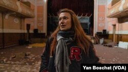 Olesya Bilyaga is the head dance coach of a team that once used this damaged theater in Izium, Ukraine, on March 30, 2023.