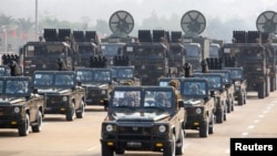 FILE - Military personnel participates in a parade on Armed Forces Day in Naypyitaw, Myanmar, March 27, 2021. 