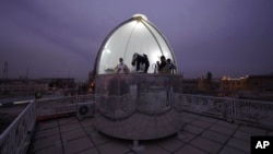 Shiites observe the crescent moon to determine the start of the 10th Islamic month of Shawwal, which marks the end of a month-long fasting of Ramadan and the beginning of the Eid al-Fitr festival in Najaf, Iraq, April 20, 2023.
