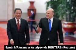 中国总理李强在北京人大会堂会晤到访的俄罗斯总理米舒斯京。（2023年5月24日）