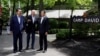 U.S. President Joe Biden greets Japanese Prime Minister Fumio Kishida, right, and South Korean President Yoon Suk Yeol during the trilateral summit Aug. 18, 2023, at Camp David near Thurmont, Md.