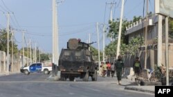 FILE - Security forces patrol the streets following an attack by suspected al-Shabab militants in the Somalia's capital Mogadishu, Feb. 21, 2023.