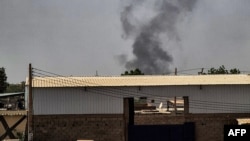 Smoke billows from a fire in a building in the center of Khartoum on May 25, 2023. 