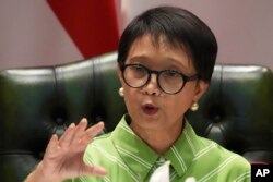 Indonesian Foreign Minister Retno Marsudi speaks during a news conference in Jakarta, Indonesia, May 5, 2023, about efforts to rescue dozens of its nationals who got trafficked to Myanmar to work as cyber scammers. Some of the were freed Sunday.