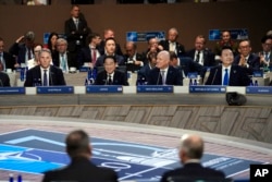 From left, Australia's Deputy Prime Minister Richard Marles, Japan's Prime Minister Fumio Kishida, New Zealand's Prime Minister Christopher Luxon and South Korea's President Yoon Suk Yeol, attend a NATO summit session in Washington, July 11, 2024.