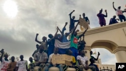 FILE - Supporters of Niger's ruling junta gather at the start of a protest called to fight for the country's freedom and push back against foreign interference in Niamey, Niger, Aug. 3, 2023.