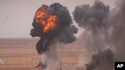 FILE - A target is hit with artillery fire as U.S and Moroccan military forces take part in the 20th edition of the African Lion military exercise, in Tantan, south of Agadir, Morocco, May 31, 2024