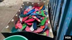 Discarded flip-flops are being washed as part of the upcycling process, at Ocean Sole, in Karen, Kenya, Jan. 17, 2024. (Mariama Diallo/VOA)