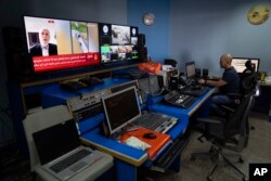 Al Jazeera broadcast engineer Mohammad Salameh works at the Master Control Room unit inside the network's office in the West Bank city of Ramallah, May 5, 2024.