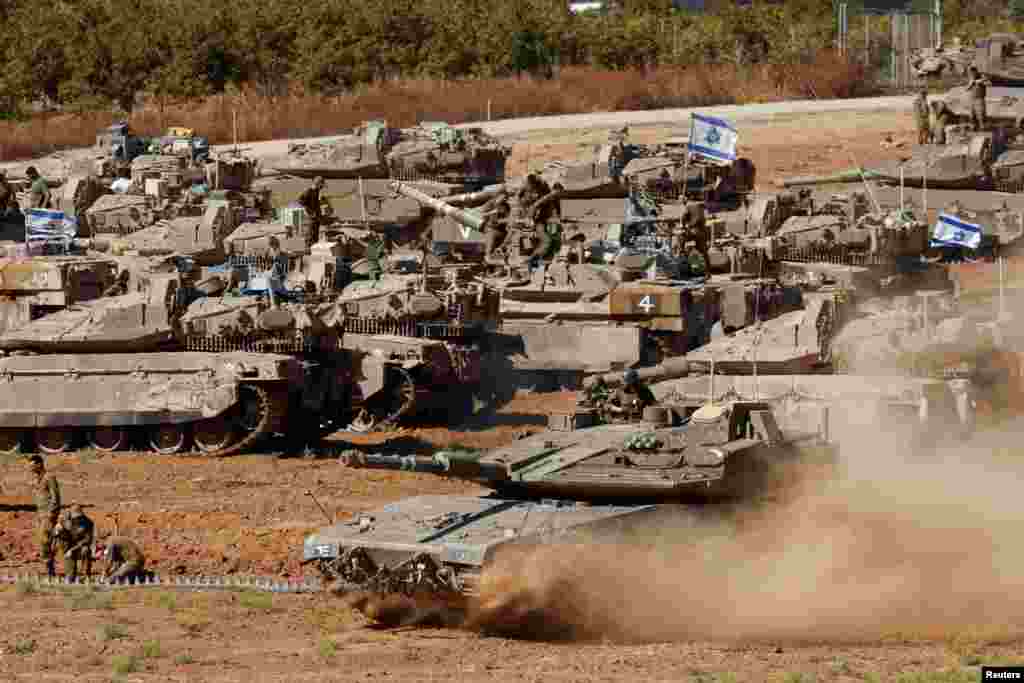 An Israeli tank maneuvers, amid the ongoing conflict between Israel and the Palestinian Islamist group Hamas, near the Israel-Gaza Border, in southern Israel.