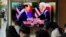 A TV screen shows an image of US President Joe Biden and South Korean President Yoon Suk Yeol in Washington, during a news program at the Seoul Railway Station in Seoul, South Korea, April 27, 2023. 