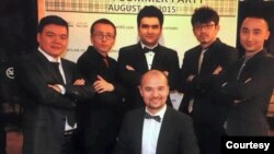 Kasim Kashgar, center front, is photographed with, from right, Semet Ababekri, Abdukadir Rozi, Akber Osman, Mirkamil Ahmed and Mehmut Abdukeyum, during a school party in Urumqi in August 2015. (Photo courtesy of Kasim Kashgar)