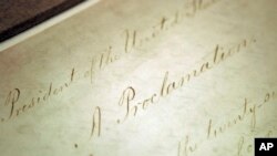 FILE - The original Emancipation Proclamation is shown on display in the Rotunda of the National Archives in Washington, Feb. 18, 2005. 