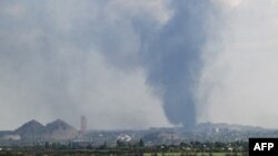 A plume of smoke rises in the area of the town of Toretsk, in Donetsk region on Aug. 24, 2025, amid the Russian invasion of Ukraine.