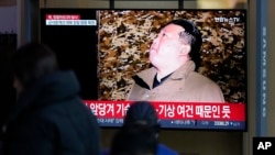A TV screen shows a report on North Korea's spy satellite into orbit with its third launch attempt this year with an image of North Korea's leader Kim Jong Un during a news program at the Seoul Railway Station in Seoul, South Korea, Nov. 22, 2023.